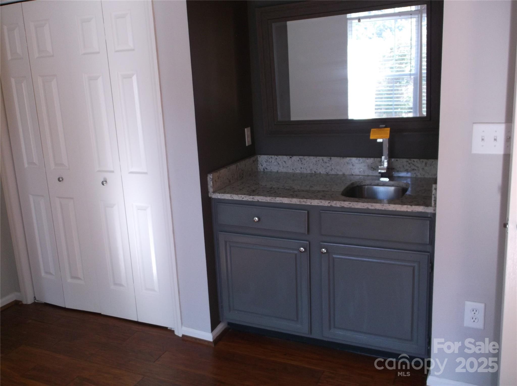 5007 Sharon Road, Unit O Charlotte, NC 28210 - Photo 7 of 20 a bathroom with a sink and a mirror