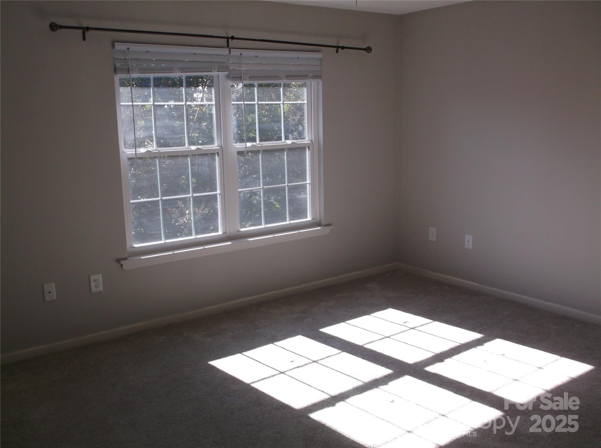 5007 Sharon Road, Unit O Charlotte, NC 28210 - Photo 10 of 20 an empty room with a window