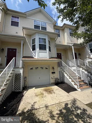 a front view of a house with a garage