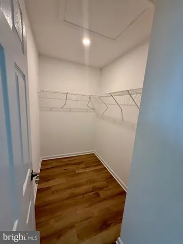 a white toilet sitting next to a bath tub