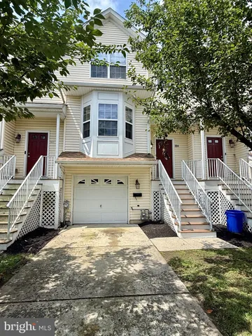 a front view of a house with a garage