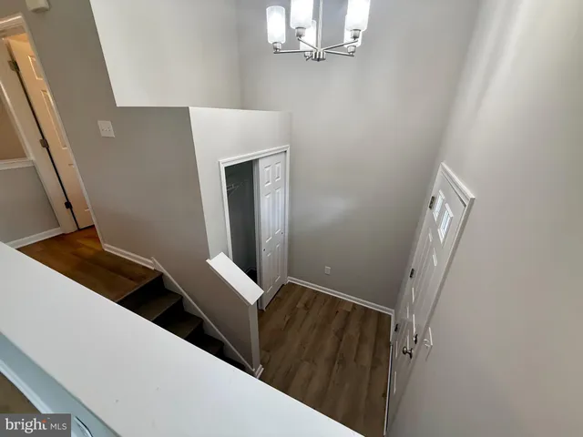 a hallway with staircase