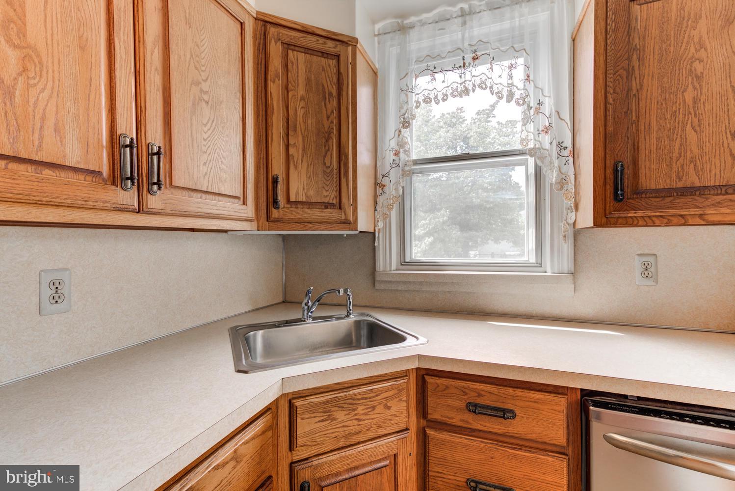 36 Woodbine Road Havertown, PA 19083 - Photo 13 of 34 a kitchen with appliances cabinets and a sink