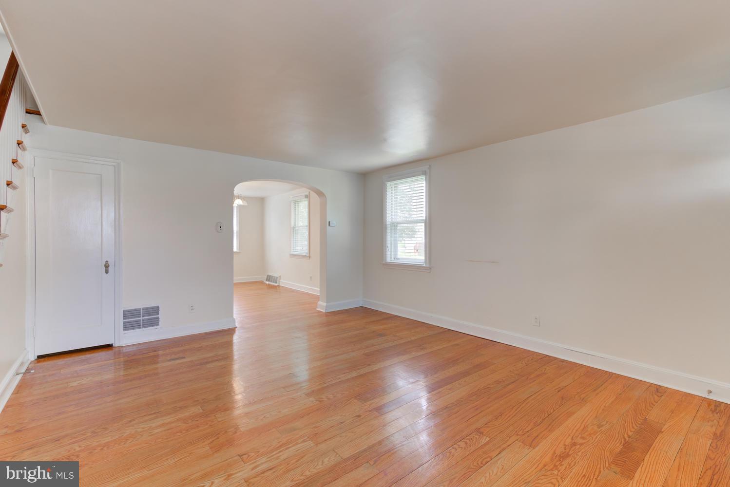 36 Woodbine Road Havertown, PA 19083 - Photo 24 of 34 an empty room with wooden floor and windows