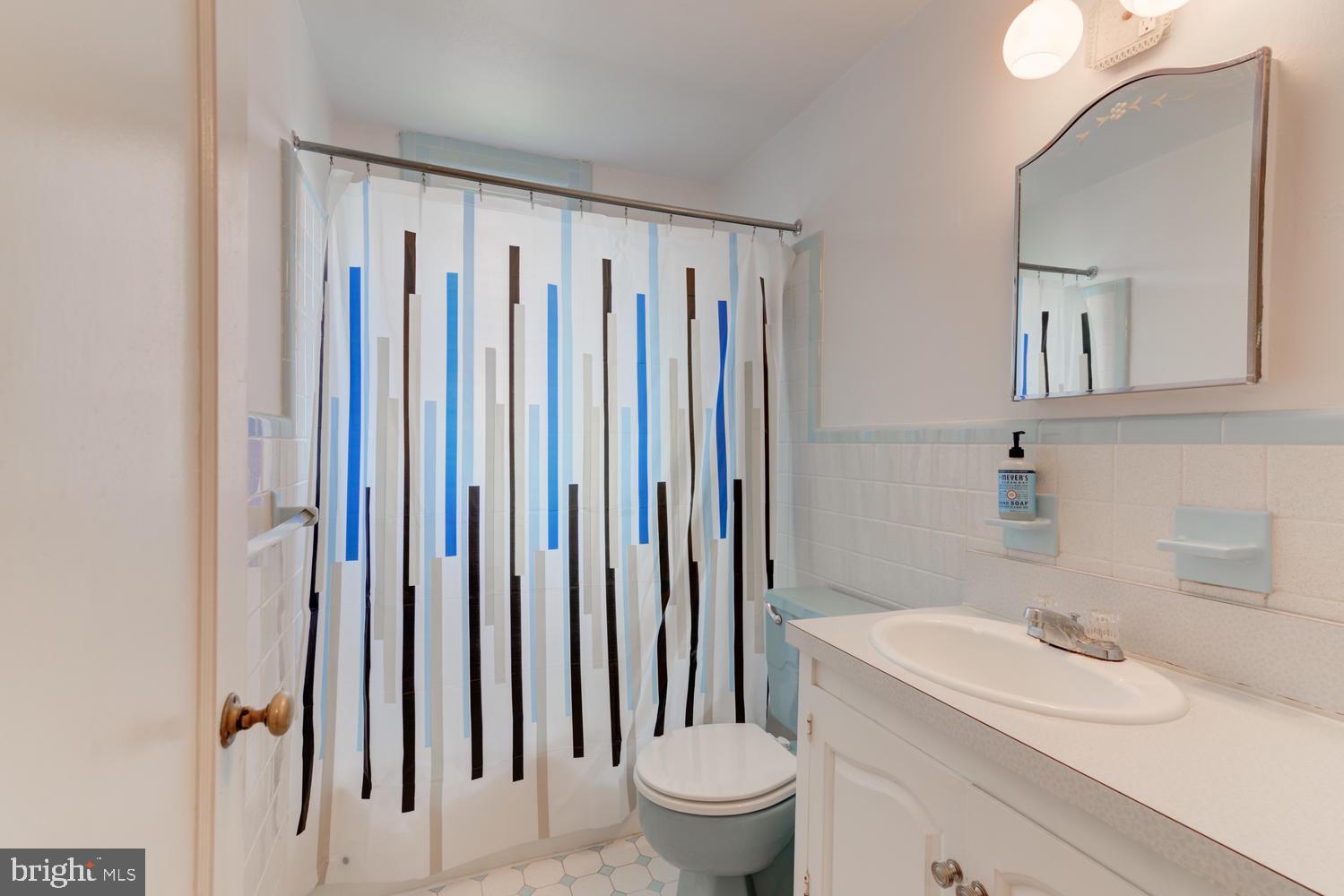 36 Woodbine Road Havertown, PA 19083 - Photo 31 of 34 a bathroom with a sink a toilet and a mirror