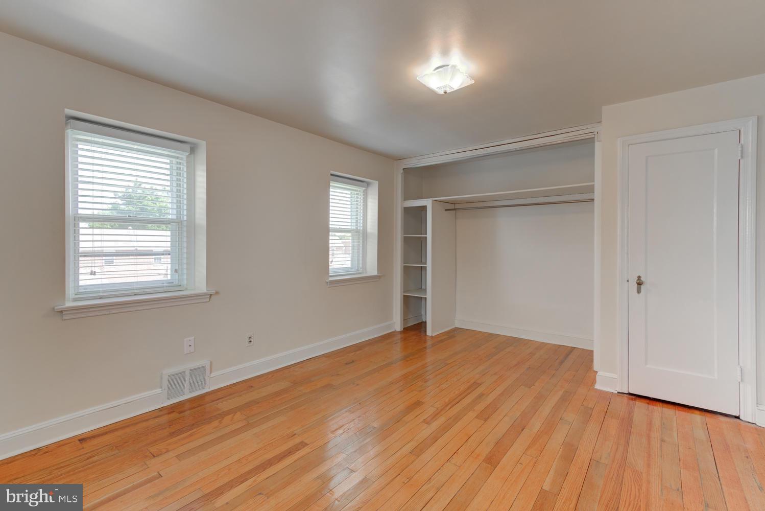 36 Woodbine Road Havertown, PA 19083 - Photo 33 of 34 a view of an empty room with wooden floor and a window