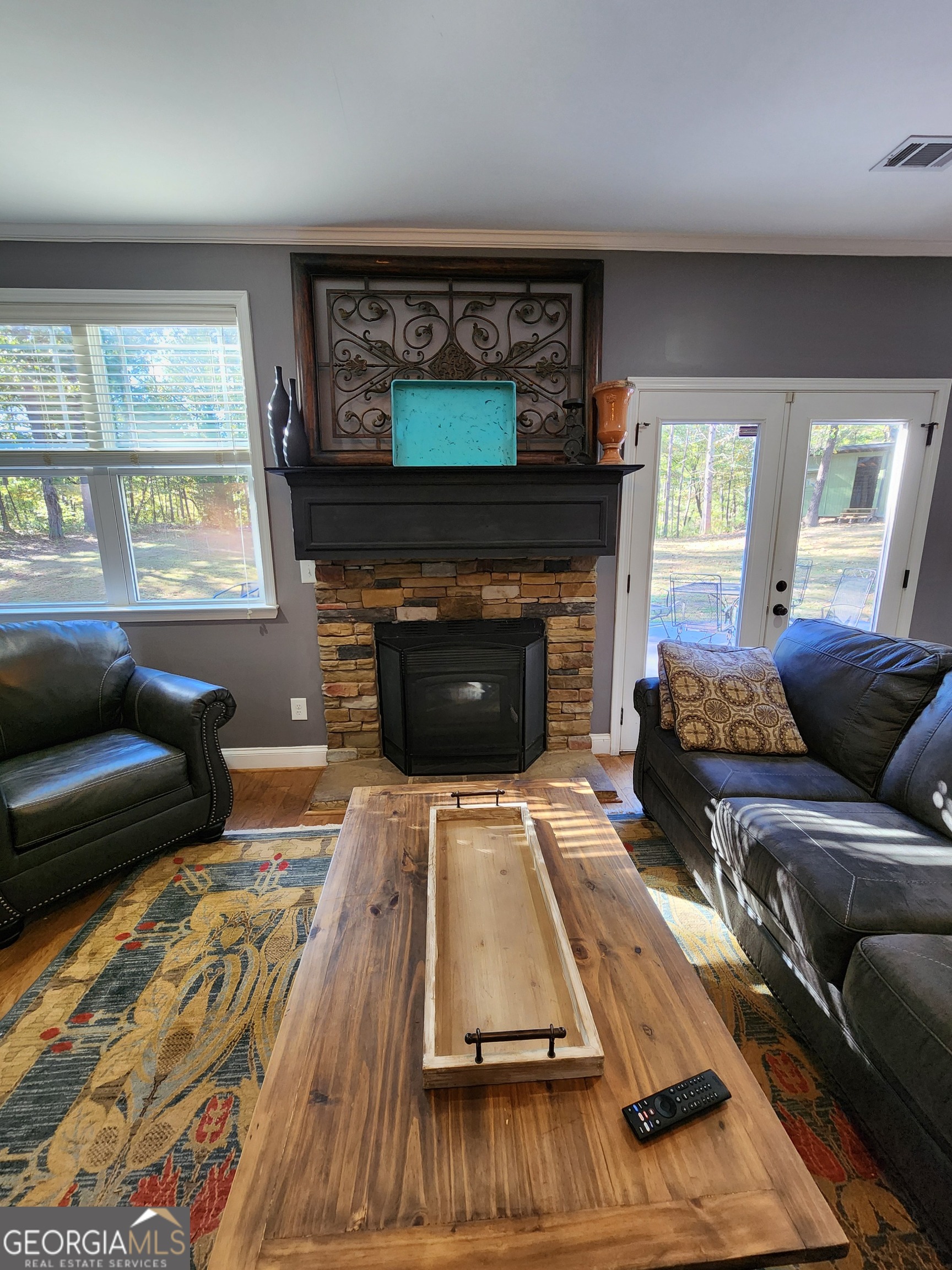 249 Serenity Loop Cataula, GA 31804 - Photo 12 of 44 a living room with furniture and a fireplace