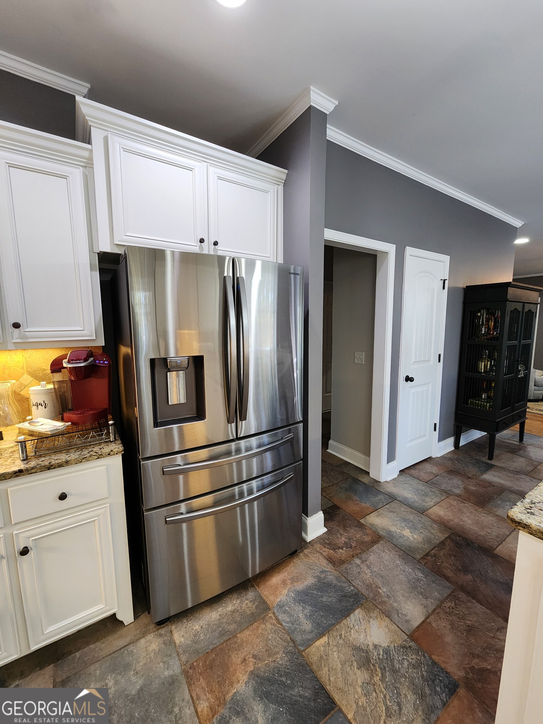 249 Serenity Loop Cataula, GA 31804 - Photo 17 of 44 a kitchen with stainless steel appliances a refrigerator and cabinets