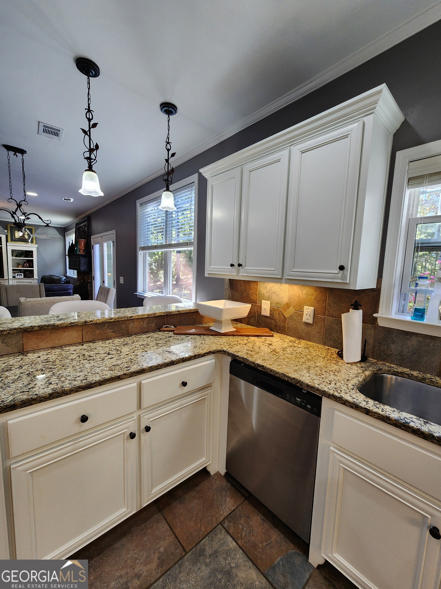 249 Serenity Loop Cataula, GA 31804 - Photo 18 of 44 a kitchen with granite countertop white cabinets and white appliances