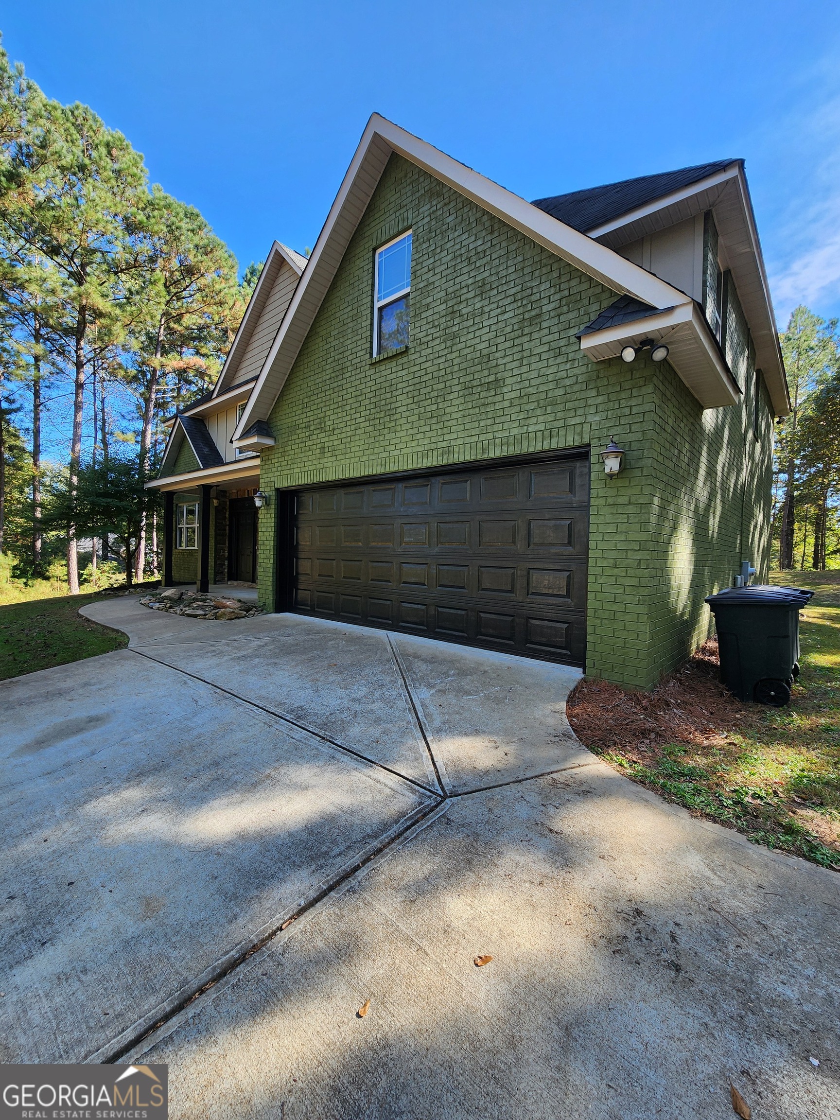 249 Serenity Loop Cataula, GA 31804 - Photo 2 of 44 a front view of a house with a yard and garage