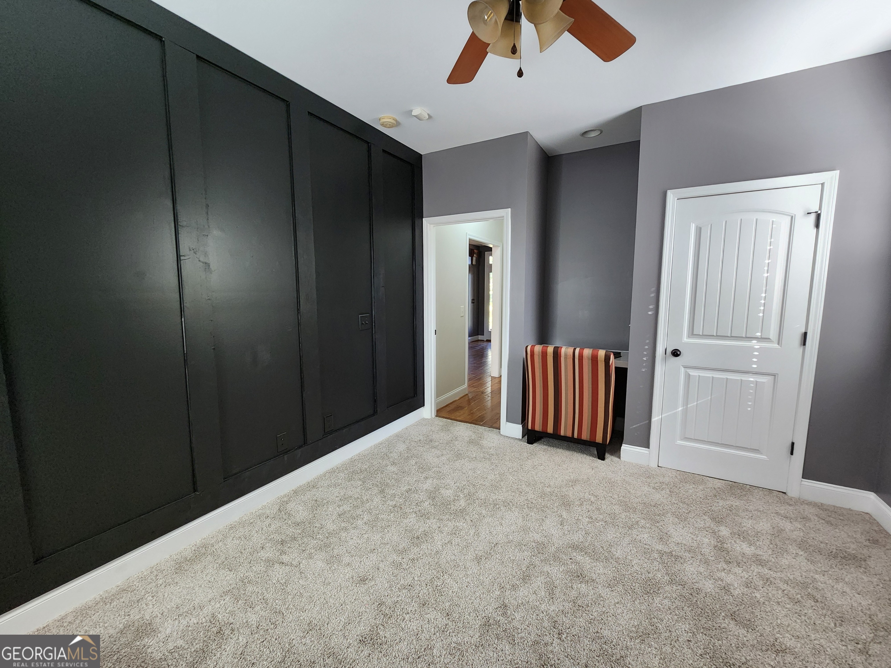 249 Serenity Loop Cataula, GA 31804 - Photo 23 of 44 an empty room with a ceiling fan and a window