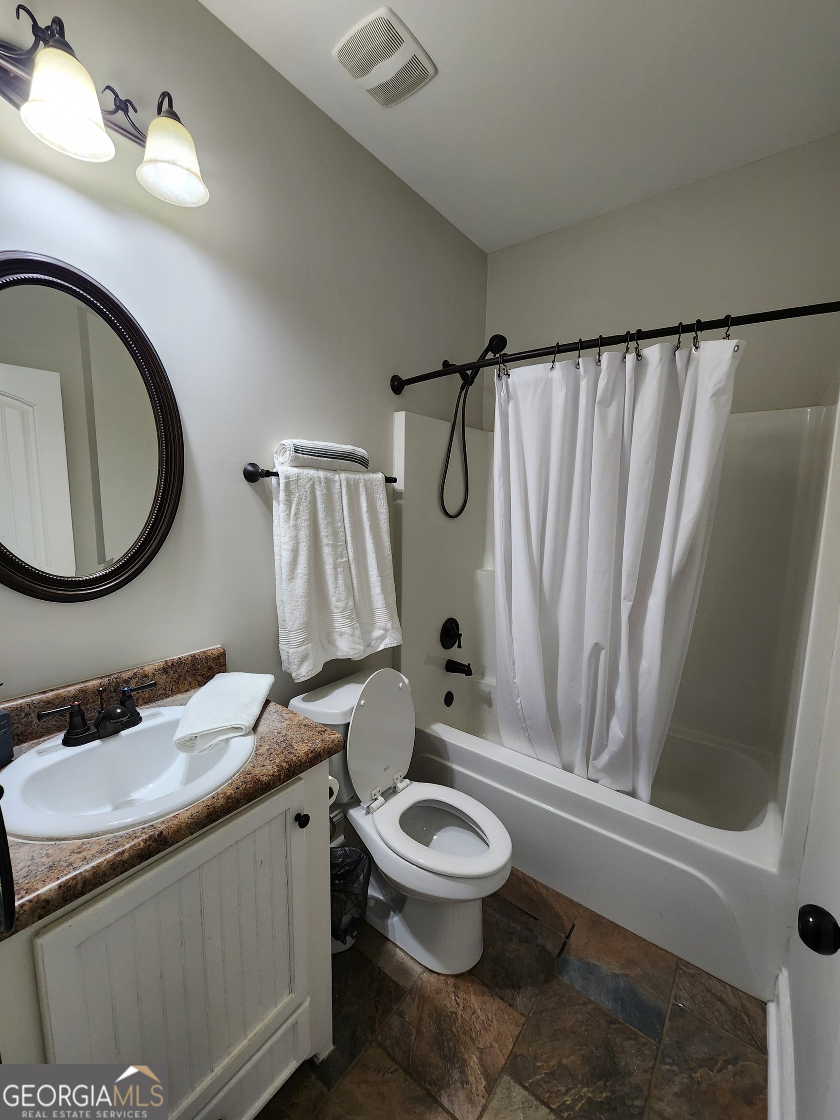249 Serenity Loop Cataula, GA 31804 - Photo 26 of 44 a bathroom with a sink a toilet and a mirror