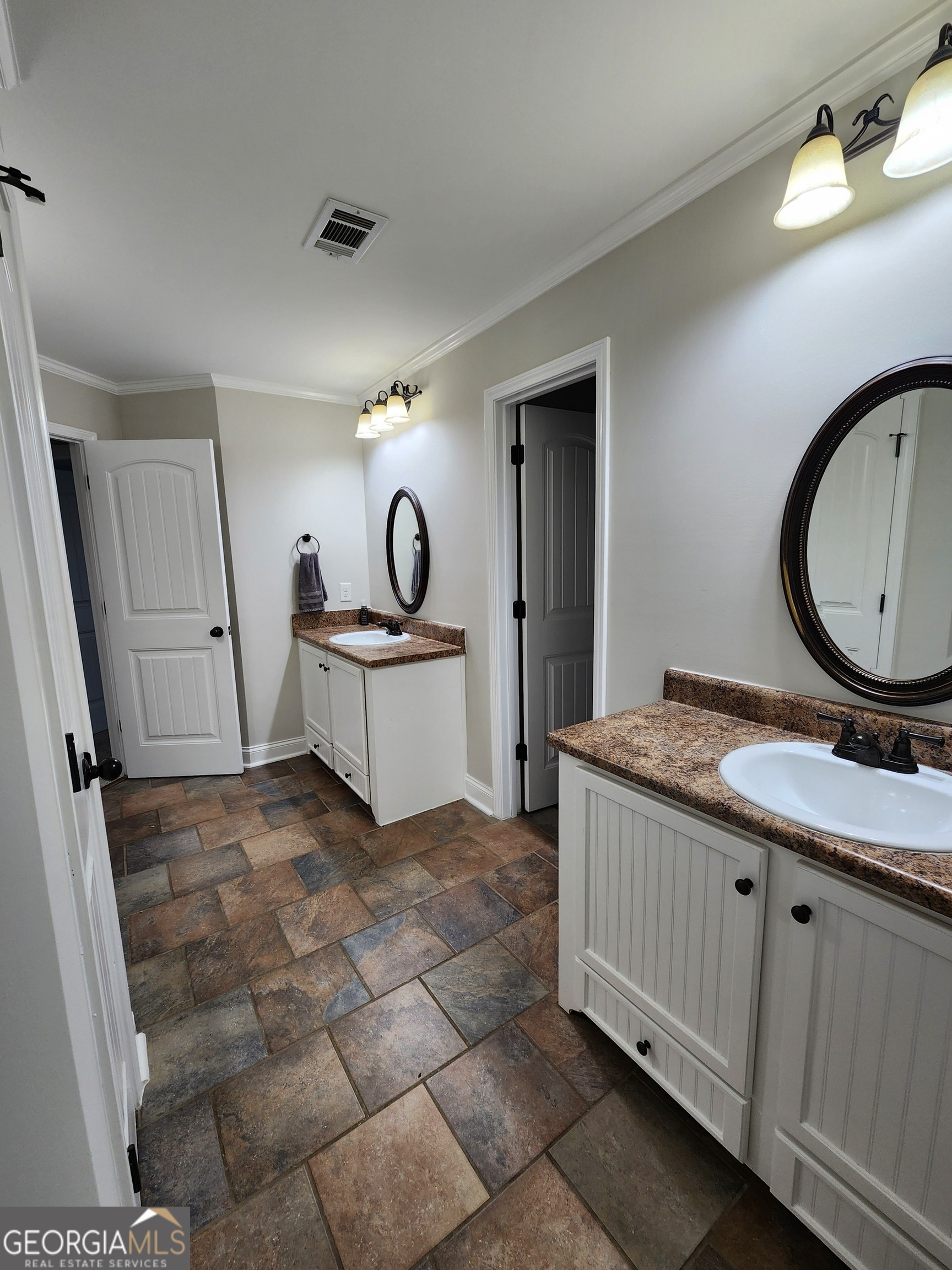 249 Serenity Loop Cataula, GA 31804 - Photo 30 of 44 a room with a sink and a mirror