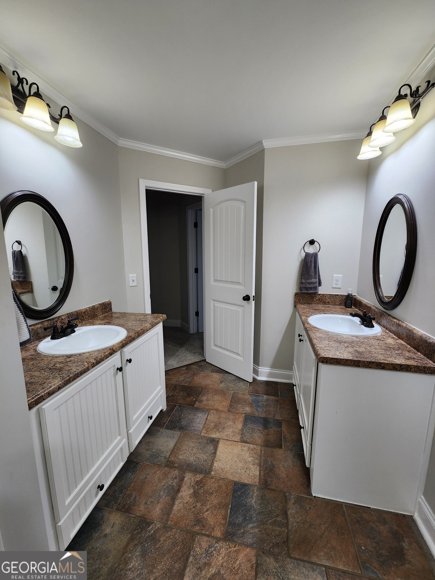 249 Serenity Loop Cataula, GA 31804 - Photo 31 of 44 a bathroom with a granite countertop sink and a mirror