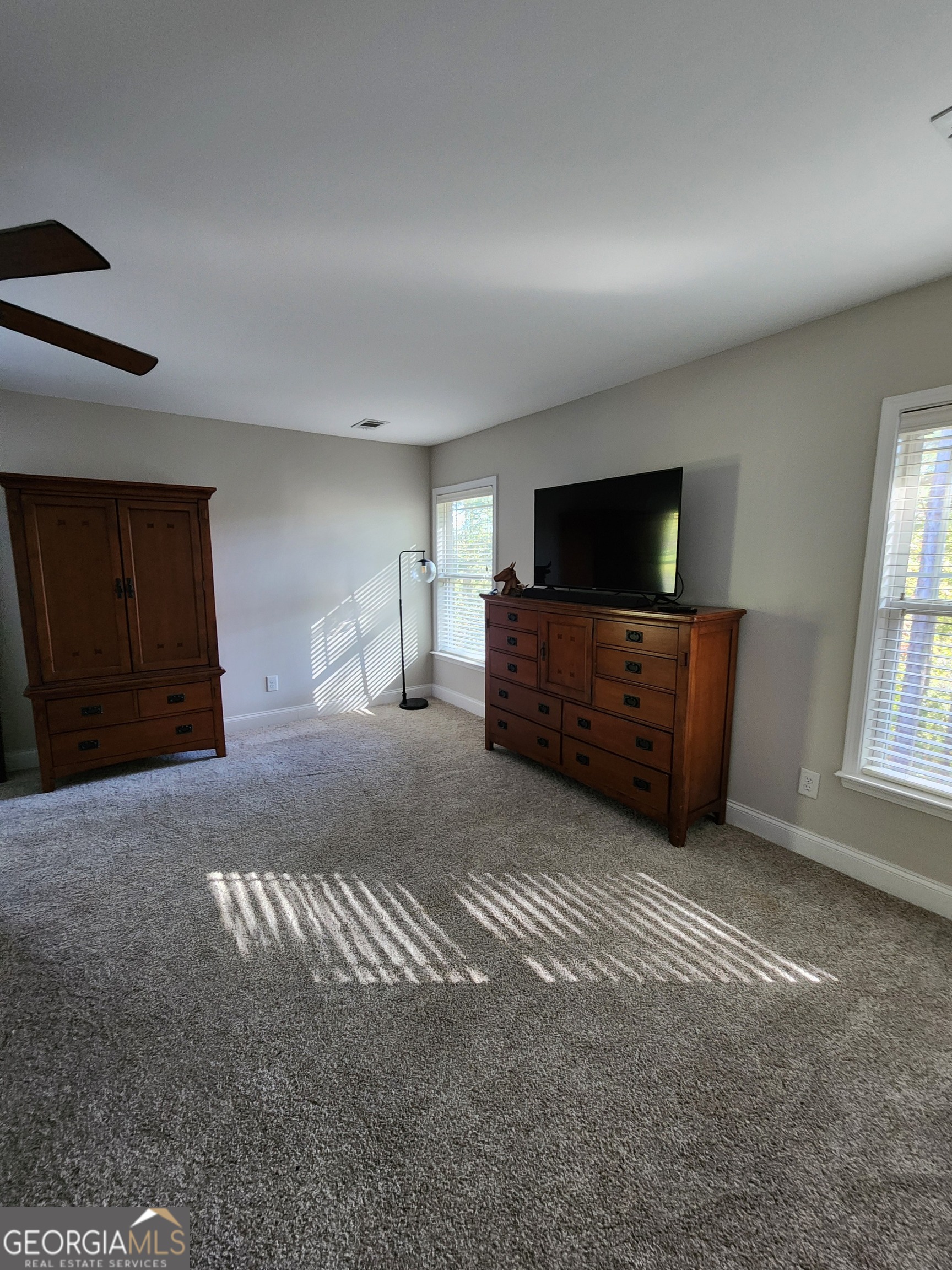 249 Serenity Loop Cataula, GA 31804 - Photo 35 of 44 a living room with furniture and a flat screen tv
