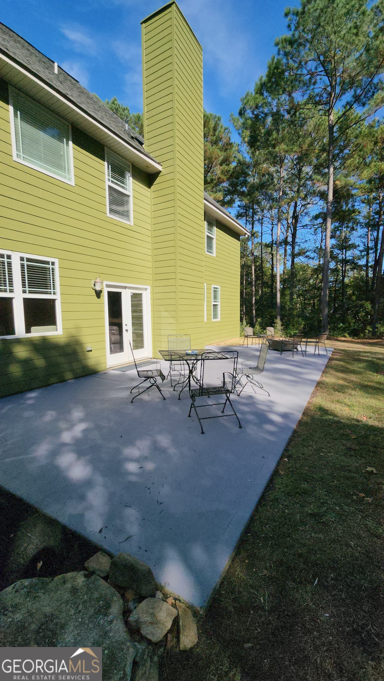 249 Serenity Loop Cataula, GA 31804 - Photo 41 of 44 a view of backyard of house with outdoor seating and green space