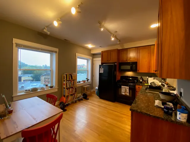 a room with furniture pool table and glass door