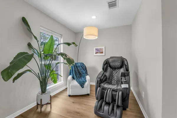 a spacious bedroom with a bed and a large window with outer view
