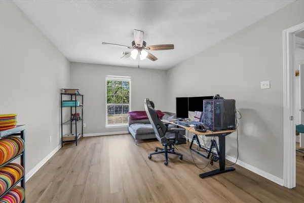 a workspace with furniture and wooden floor