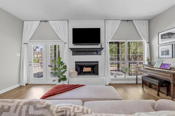 a large kitchen with stainless steel appliances kitchen island granite countertop a large kitchen island a refrigerator and a sink