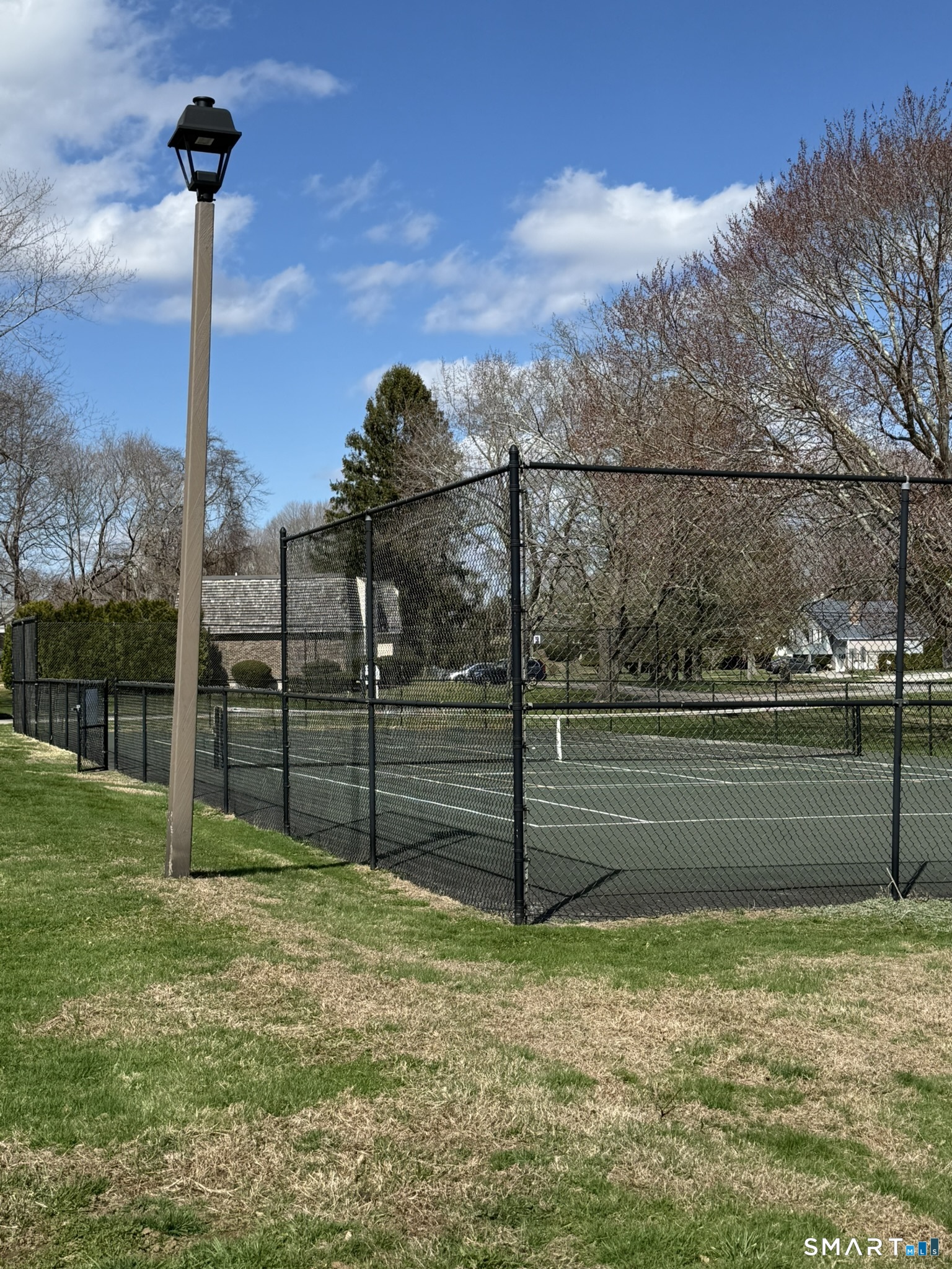 127 Black Point Road, Unit 31 East Lyme, CT 06357 - Photo 9 of 12 Onsite tennis courts are steps from your front door.