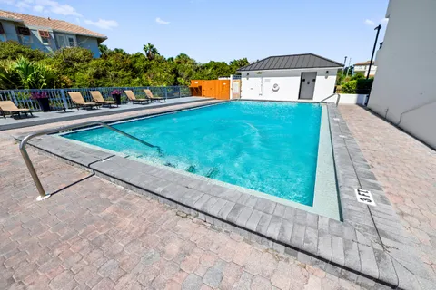 a view of a house with a yard and a porch