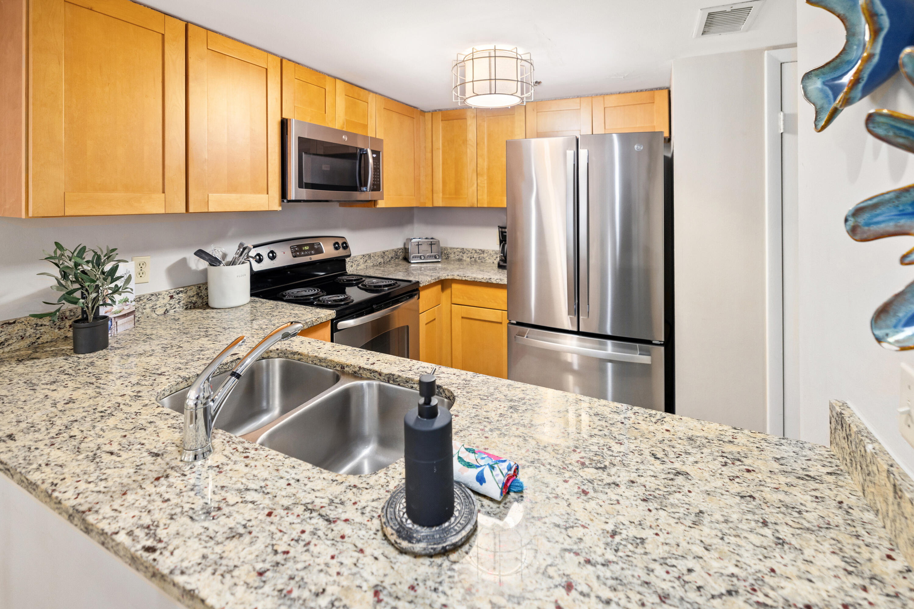 4100 East County Highway 30A, Unit 1003 Santa Rosa Beach, FL 32459 - Photo 7 of 24 a kitchen with a refrigerator sink and microwave