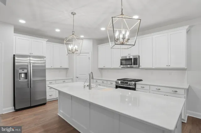 a spacious bathroom with a double vanity sink and a mirror