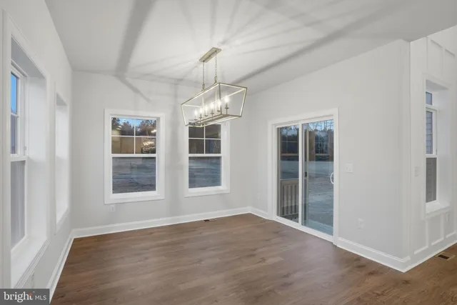 a kitchen with stainless steel appliances a sink stove and cabinets
