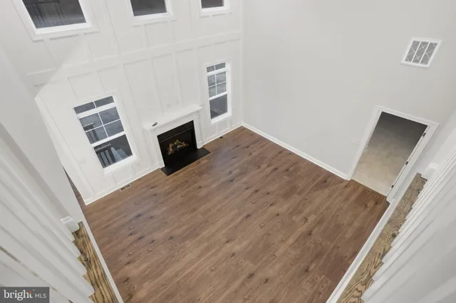 a view of entryway with wooden floor and stairs