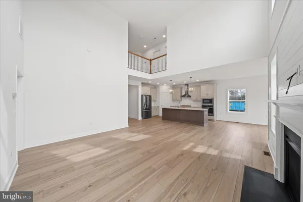 a kitchen with stainless steel appliances a refrigerator sink and microwave