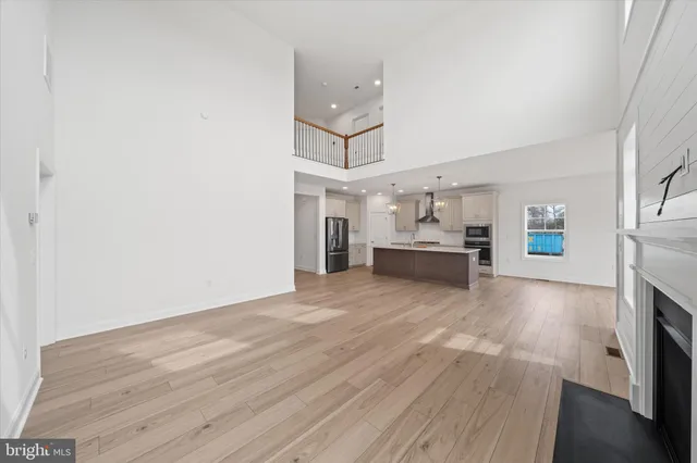 a kitchen with stainless steel appliances a refrigerator sink and microwave