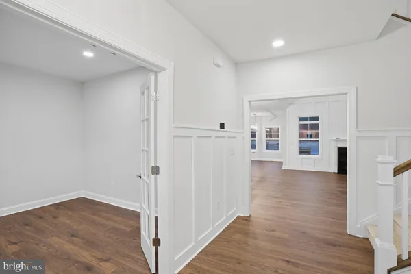 a kitchen with stainless steel appliances a sink stove and cabinets