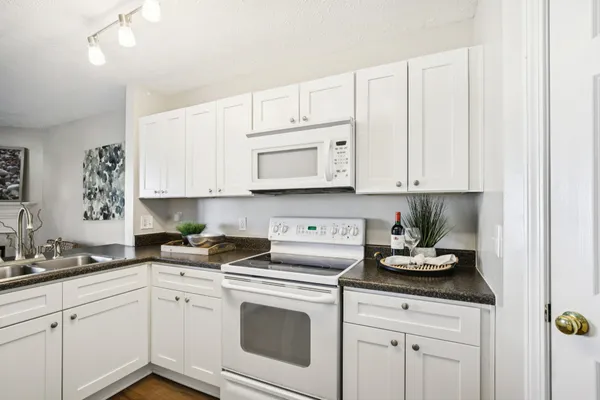 a kitchen with sink cabinets and window