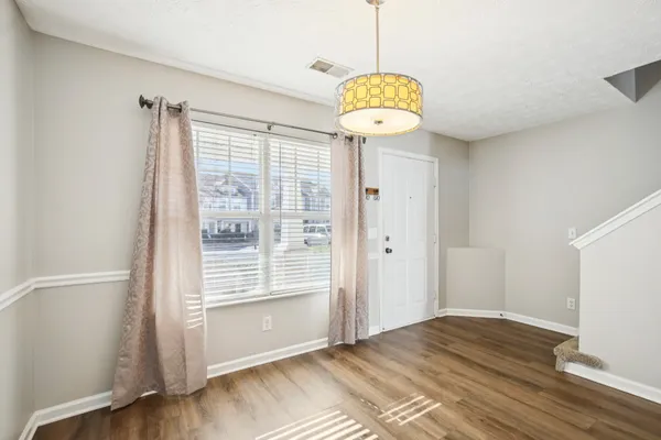a view of entryway with wooden floor