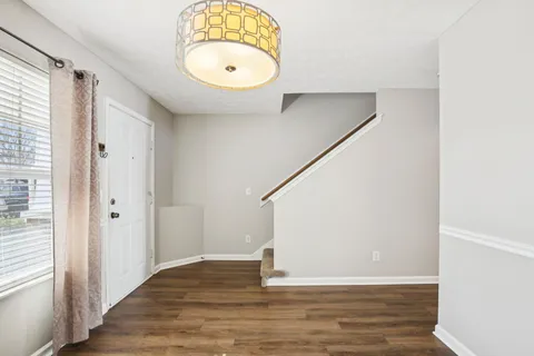a view of a room with window and wooden floor