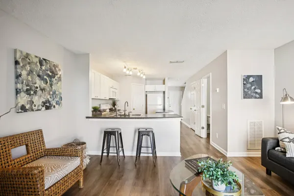 a living room with furniture and a table