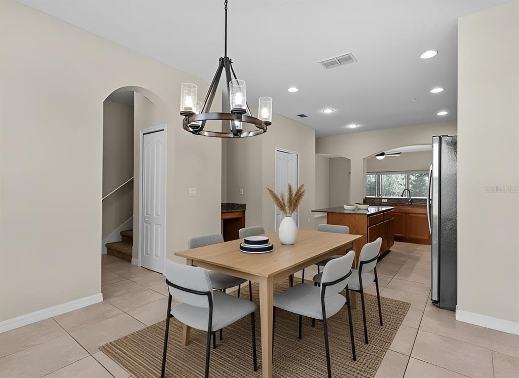 800 Callista Cay Loop Tarpon Springs, FL 34689 - Photo 14 of 36 a view of a dining room with furniture