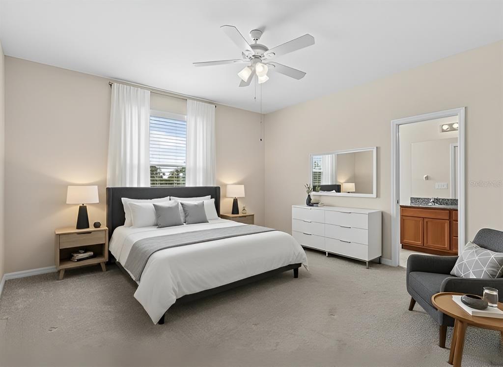 800 Callista Cay Loop Tarpon Springs, FL 34689 - Photo 16 of 36 a bedroom with bed chair and window