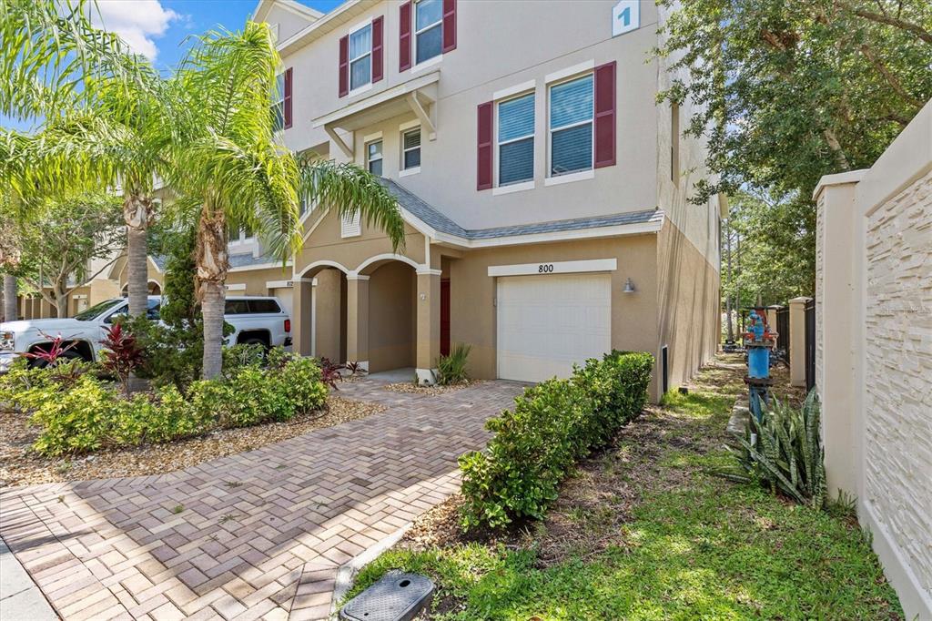 800 Callista Cay Loop Tarpon Springs, FL 34689 - Photo 2 of 36 a front view of a house with garden