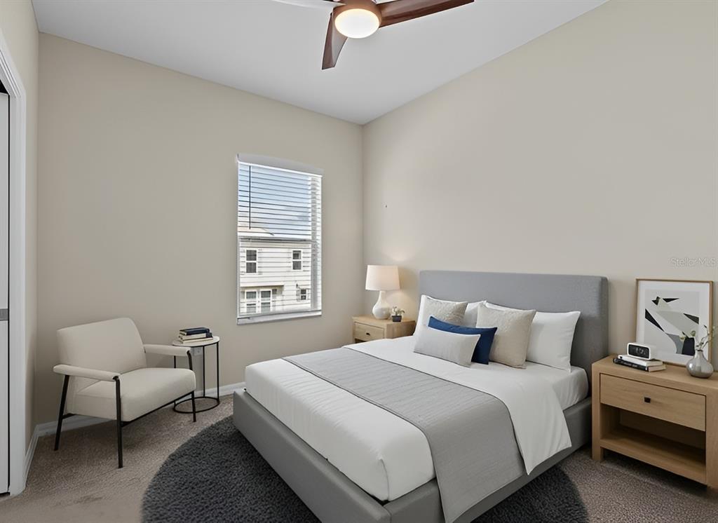 800 Callista Cay Loop Tarpon Springs, FL 34689 - Photo 24 of 36 a bedroom with a bed and a couch