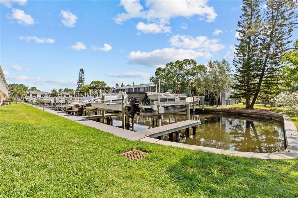 800 Callista Cay Loop Tarpon Springs, FL 34689 - Photo 29 of 36 a view of a swimming pool with lawn chairs