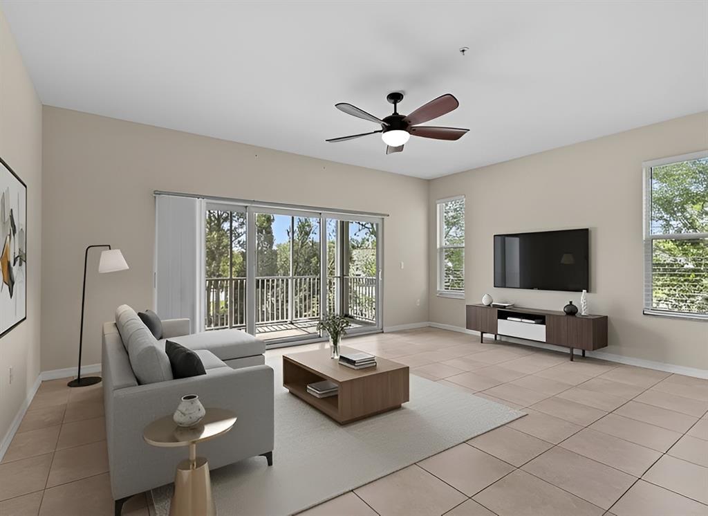 800 Callista Cay Loop Tarpon Springs, FL 34689 - Photo 6 of 36 a living room with furniture and a flat screen tv