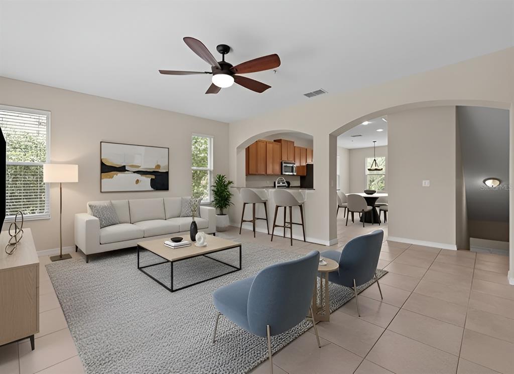 800 Callista Cay Loop Tarpon Springs, FL 34689 - Photo 7 of 36 a living room with furniture and a wooden floor