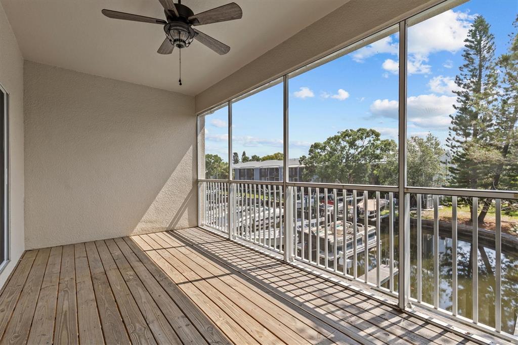 800 Callista Cay Loop Tarpon Springs, FL 34689 - Photo 10 of 36 a view of a balcony with wooden floor