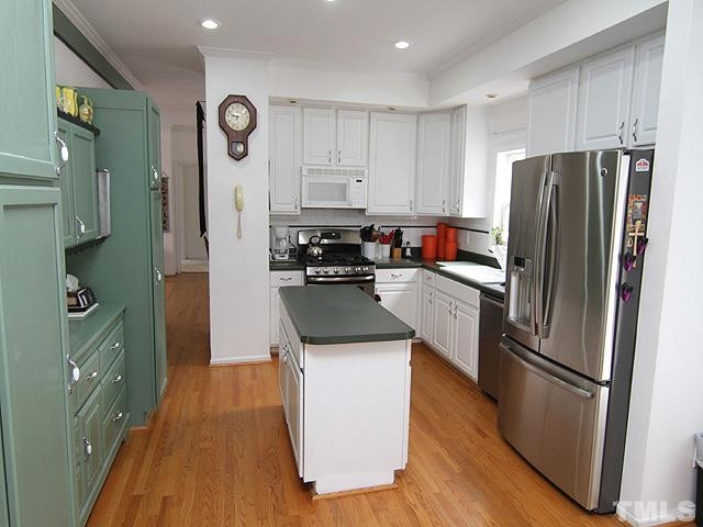 2833 Shepard School Road Zebulon, NC 27597 - Photo 4 of 12 Upgraded galley kitchen with a traditional oven and double oven. Also contains a unique pantry Kitchen