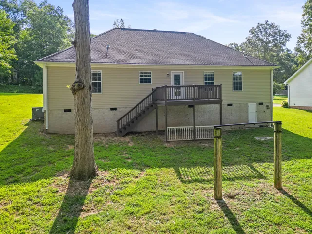 a view of house with backyard