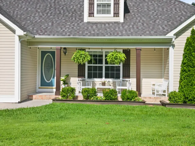 a front view of a house with garden