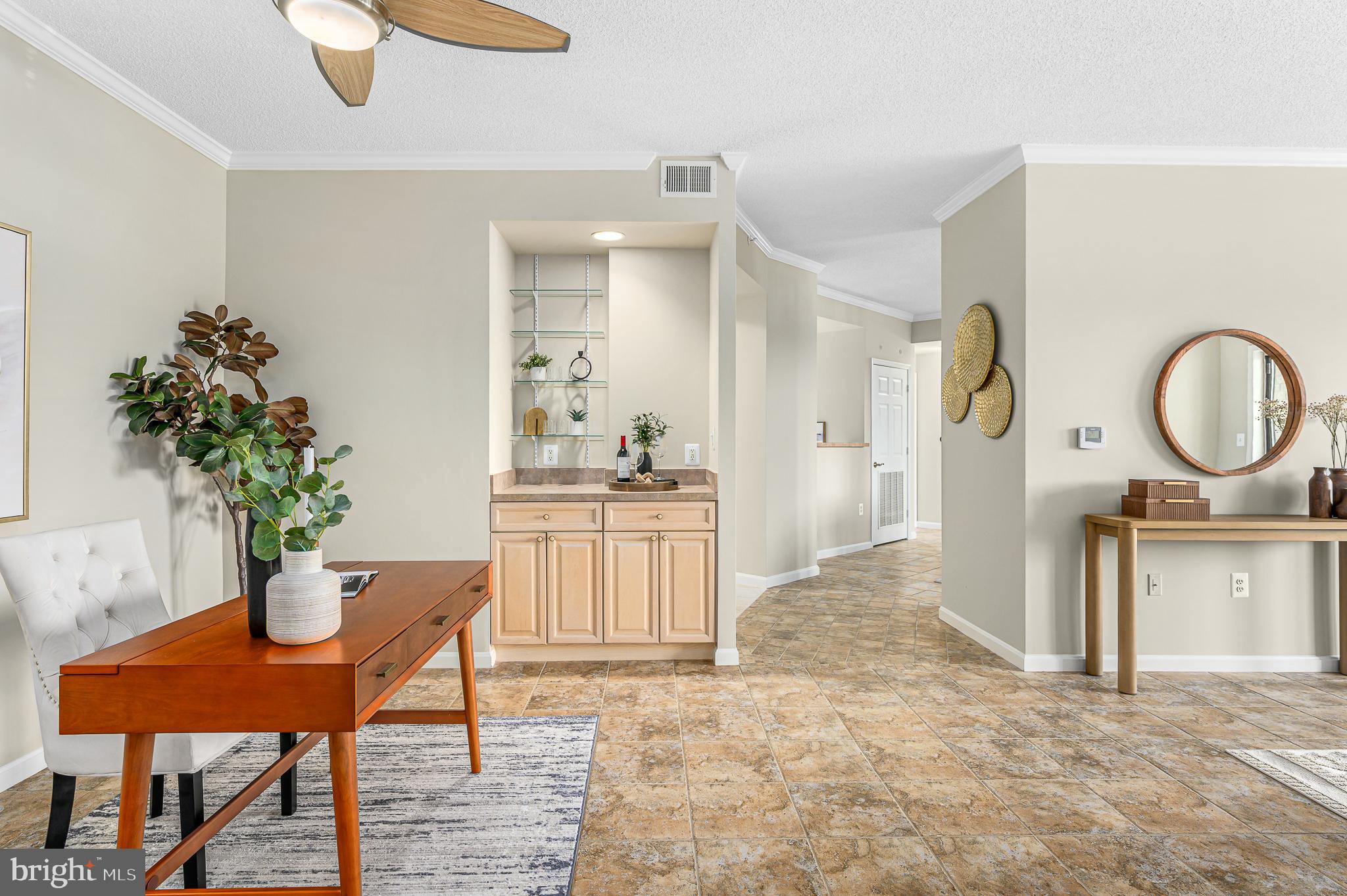 19375 Cypress Ridge Terrace, Unit 114 Leesburg, VA 20176 - Photo 11 of 42 a living room with furniture a potted plant and kitchen view