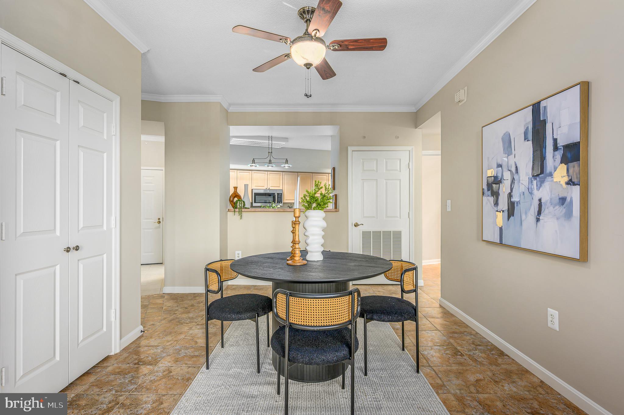 19375 Cypress Ridge Terrace, Unit 114 Leesburg, VA 20176 - Photo 12 of 42 a view of a dining room with furniture and a chandelier